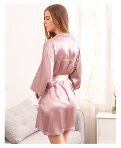 Pink satin bridesmaid robe with Bridesmaid embroidery on the back and belted waist detail