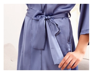 Detailed view of lavender satin bridal robe with silk texture and elegant waist tie knot