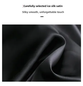 Macro detail of high-quality black ice silk satin fabric with smooth glossy finish