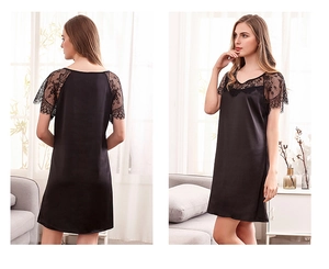 Détail d'une nuisette en satin noir avec dentelle florale sur les manches et le décolleté