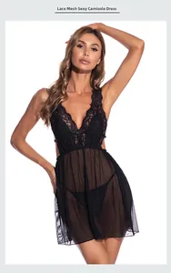 Detailed view of sheer black floral lace bodice and mesh hemline of the sexy slip dress