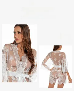 Detail of white floral lace robe featuring sheer mesh texture and eyelash lace trim