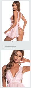 Detail of pink lace mesh nightgown featuring back slit and intricate floral texture