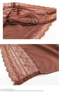 Detail view of adjustable silk shoulder straps with premium metallic buckles