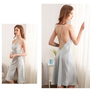 Detail of silver satin sleepwear with cross back straps and sexy side split hem