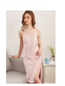 Detail of dusty pink satin slip dress with a side slit and elegant silk texture fabric