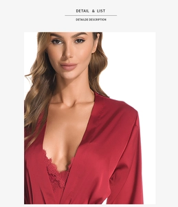 Détail du décolleté d'un peignoir en satin rouge avec dentelle fine et texture soyeuse