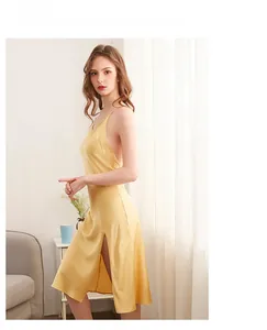 Detail of yellow silk satin nightgown featuring an open back and side slit design