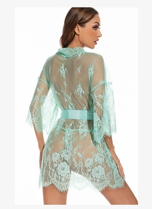 Close-up of mint green sheer floral lace robe featuring wide sleeves and satin waist belt
