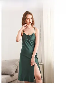 Detail of dark green silk satin nightgown featuring a high side slit and delicate straps