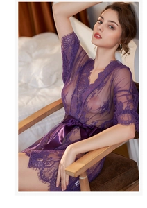Detail of purple sheer lace robe featuring floral patterns and eyelash trim edges