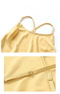 Detail showing adjustable straps and satin texture of a mustard yellow nightdress