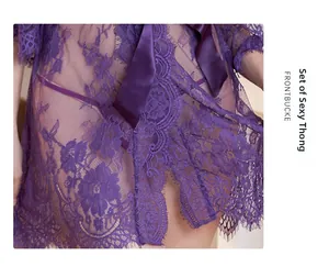 Detailed view of sheer purple floral lace robe with satin bow and eyelash trim