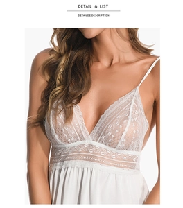 Detail view of white ice silk nightgown featuring delicate floral lace and deep V neckline