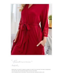 Detail of dark red modal bathrobe featuring lace sleeves and functional side pockets