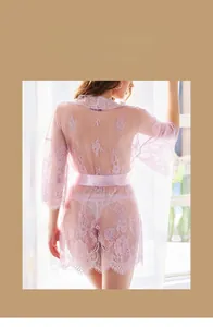 Close-up of pink lace bathrobe featuring delicate floral embroidery and satin waist tie