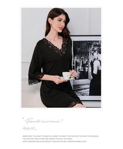 Detail of elegant black V-neck modal nightgown with delicate lace trim on the sleeves