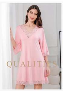 Detailed view of the elegant lace V-neckline and soft modal fabric on this pink nightdress