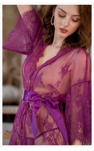 Detail of purple lace sleepwear with eyelash trim and elegant satin sash belt