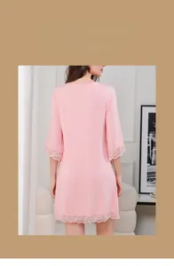 Detail of soft pink modal nightdress featuring elegant lace trim on sleeves and hemline