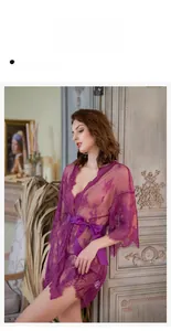 Detail of purple lace robe with sheer floral patterns and elegant satin waist bow tie