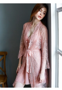 Detailed view of pink lace loungewear set with floral embroidery and silk belt
