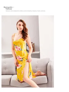 Detail of yellow silk-like slip dress with red floral patterns and side slit design