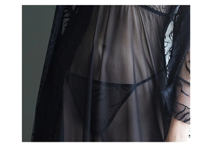 Detail shot of black sheer lace lingerie set featuring transparent mesh and floral trim