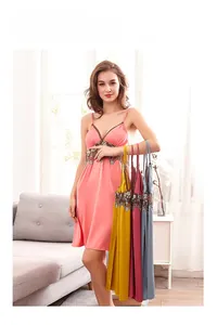 Detailed view of satin slip nightgown showing lace trim in pink, yellow, red and blue