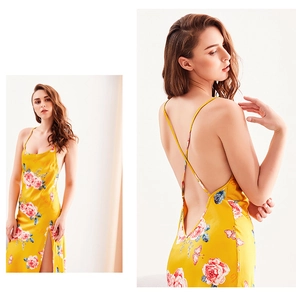 Detail of yellow floral silk nightgown with cross-back straps and side slit design