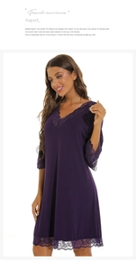Close-up of elegant V-neck lace neckline and modal fabric on dark purple nightgown