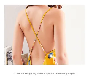 Detailed back view of yellow satin nightgown with cross backless design and floral patterns