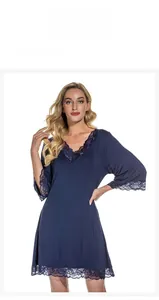 Detailed close-up of delicate lace trim on V-neck modal nightgown in deep blue color