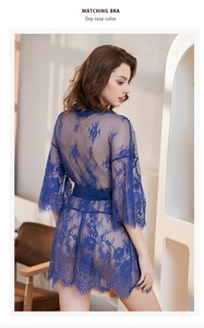 Detailed close-up of dark blue floral lace robe featuring delicate eyelash trim and satin belt
