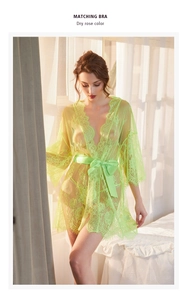 Close-up of fluorescent green floral lace robe with delicate eyelash lace trim and satin belt