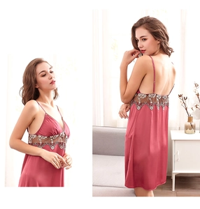 Lace embroidery detail on satin sleepwear showing front and back views of pink nightgown