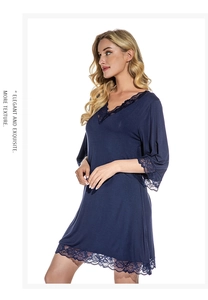 Close-up of navy modal nightgown featuring delicate lace trim on V-neck and sleeves