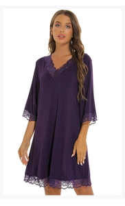 Detail of the deep purple lace V-neckline and modal cotton fabric of the nightgown