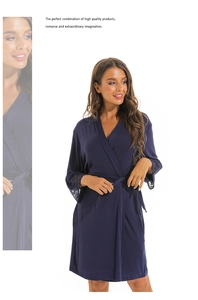 Detail of dark blue modal sleepwear featuring intricate lace cuffs and waist tie belt