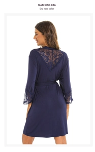 Close-up of elegant V-shaped lace back detail on a silk navy modal robe with belt