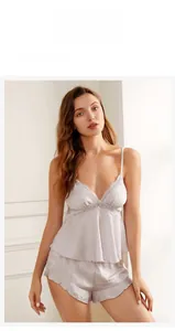 Detail view of purple satin camisole set with lace trim and matching ruffle hem shorts