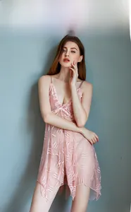 Close-up of pink sheer lace nightgown featuring V-neck embroidery and bow detail