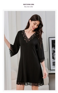 Close-up of black modal nightdress featuring V-neckline and intricate floral lace trim