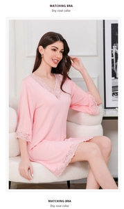 Close-up of elegant dry rose lace trim on V-neck modal cotton nightgown sleeves