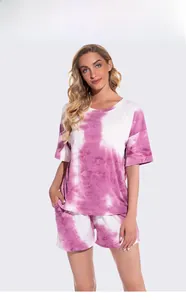 Detail of pink tie-dye two-piece loungewear set featuring soft round neck short sleeve tee