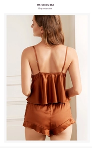 Detail view of the back of a dry rose satin pajama set with ruffles and adjustable straps