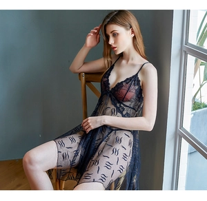 Close-up of black sheer lace nightgown featuring deep V-neck and wave embroidery patterns