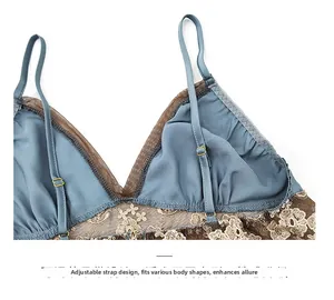Detail of adjustable shoulder strap design on a blue silk lace lingerie camisole