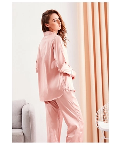 Detail of pink satin silk pajama set with premium piping on cuffs and collar