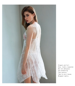 Detail of white transparent lace nightdress with delicate mesh floral texture